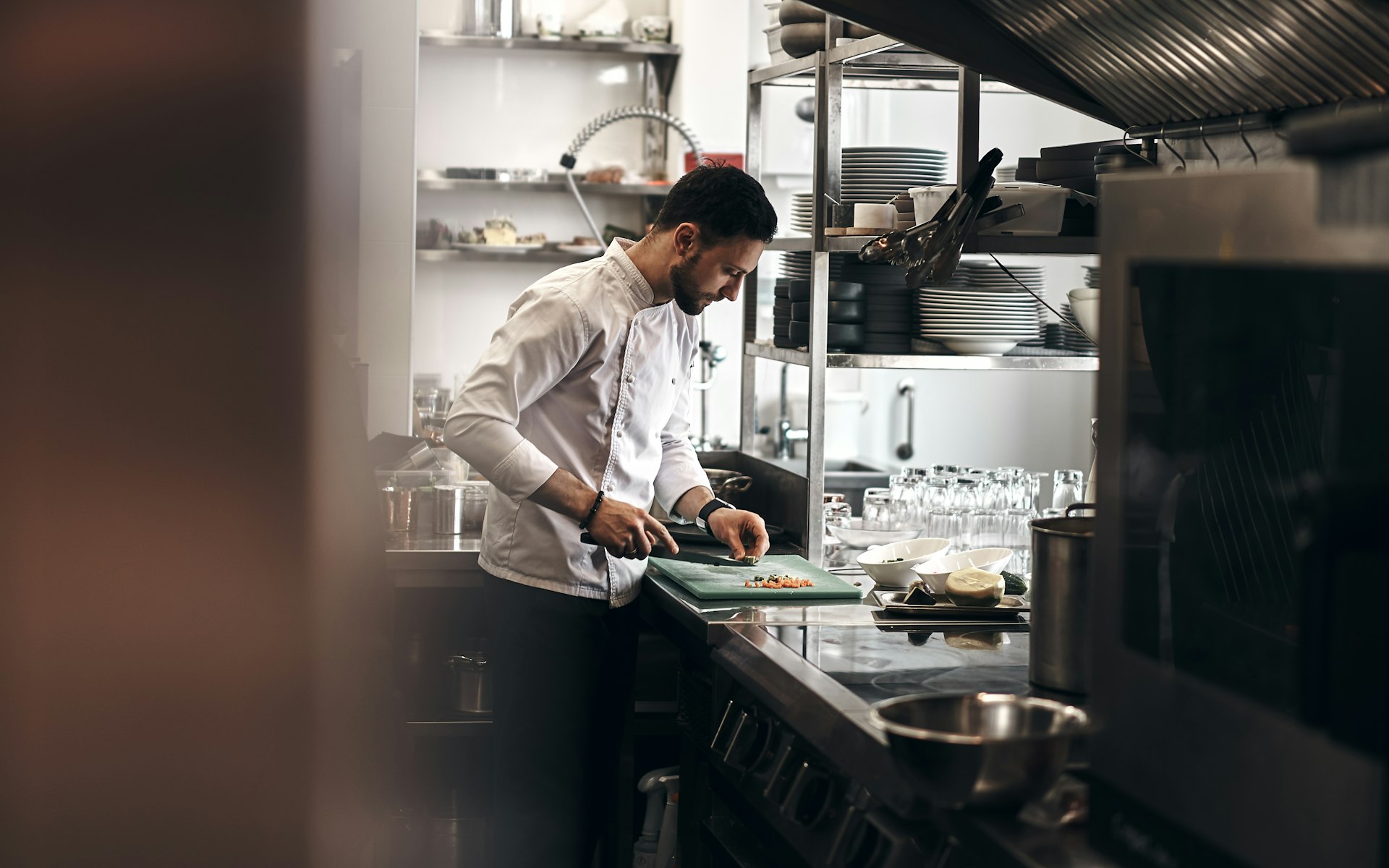 Hospitality Equipment Finance for Cafes, Restaurants and Bars – Chef preparing food in a commercial kitchen