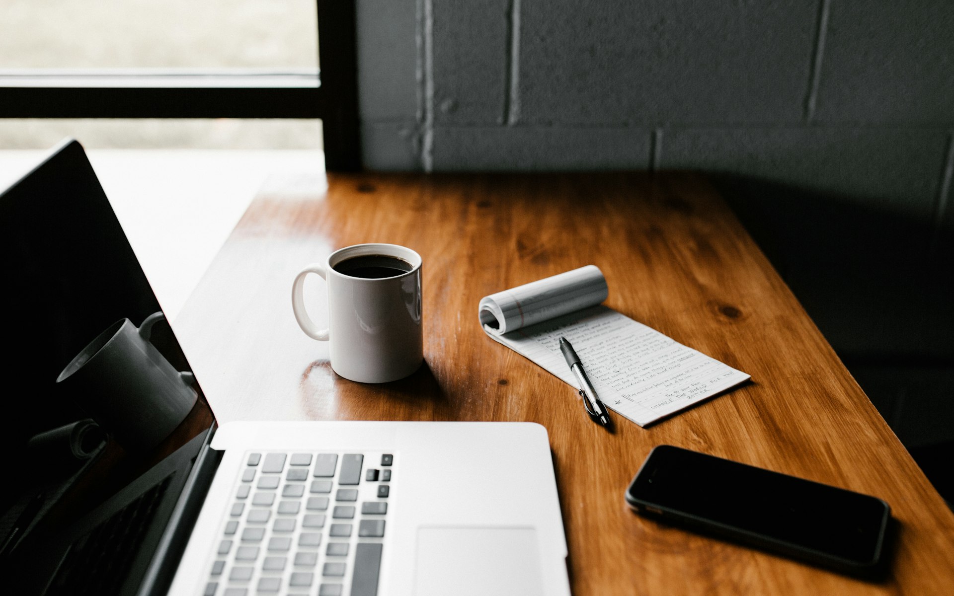 Fast Personal Loans, Done Sensibly – Business owner's laptop and coffee on a desk