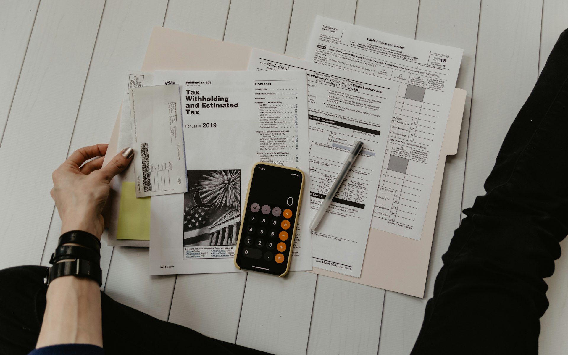 Equipment Finance Checklist: Everything You Need to Get Approved – Business paperwork, calculator and pen